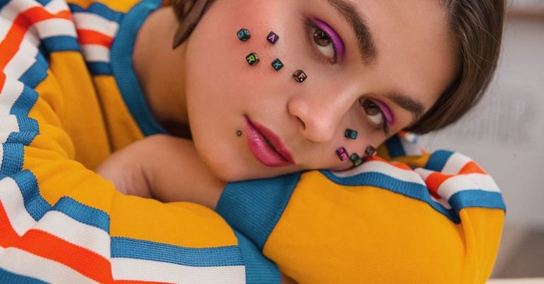 Design Features - Young woman with beads on face