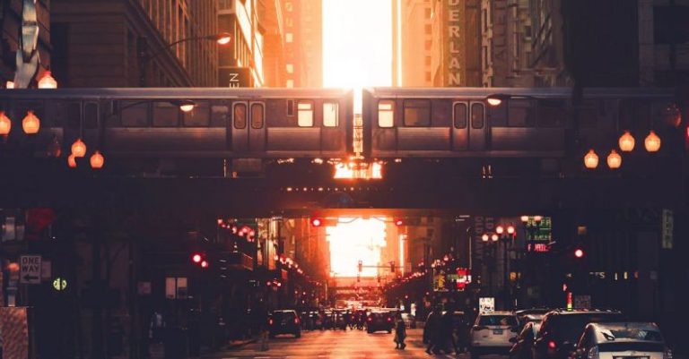 Property Location - Urban city district with modern high rise architecture and elevated railway in early evening
