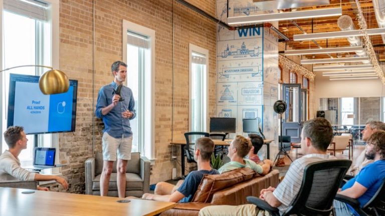 Real Estate Abroad - man standing in front of group of men