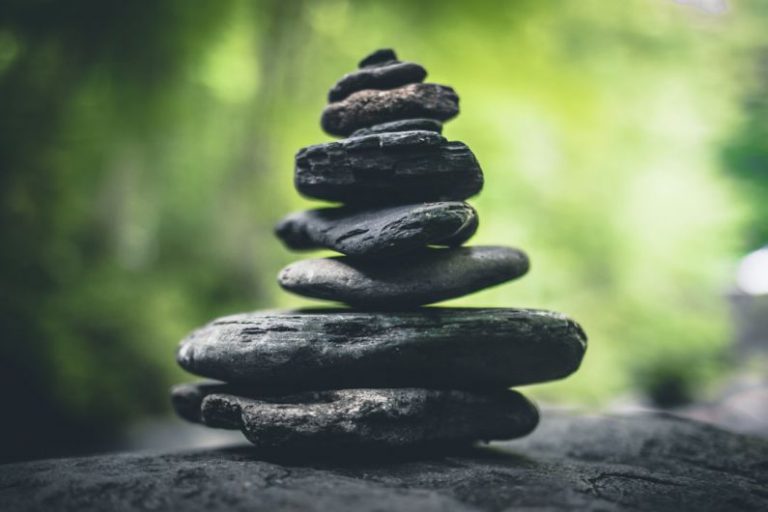 Resale Value - black stacking stones on gray surface