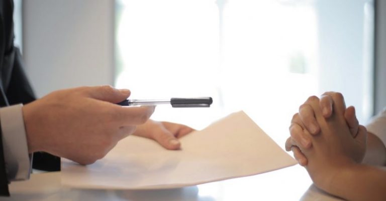 Property Manager - Crop businessman giving contract to woman to sign
