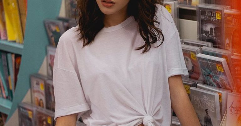 Rental Rates - Shallow Focus Photo of Woman in White T-shirt