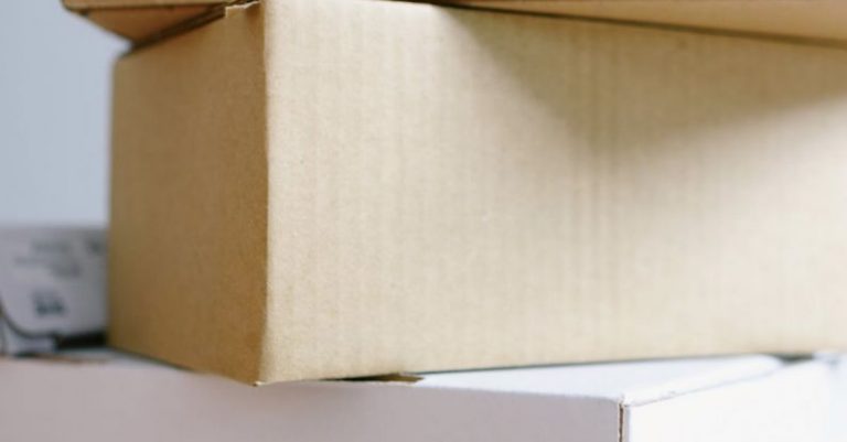 Eco-Friendly Properties - Stack of carton boxes on table