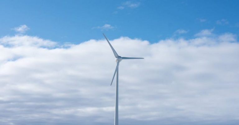 Renewable Energy Sources - Wind Turbine on a Snowy Land